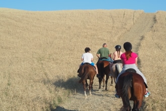 Val d'Orcia a cavallo con bambini